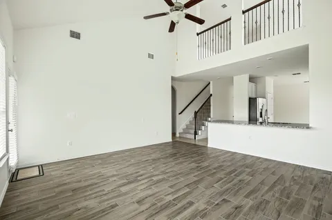 a kitchen with stainless steel appliances granite countertop a sink a stove and a refrigerator