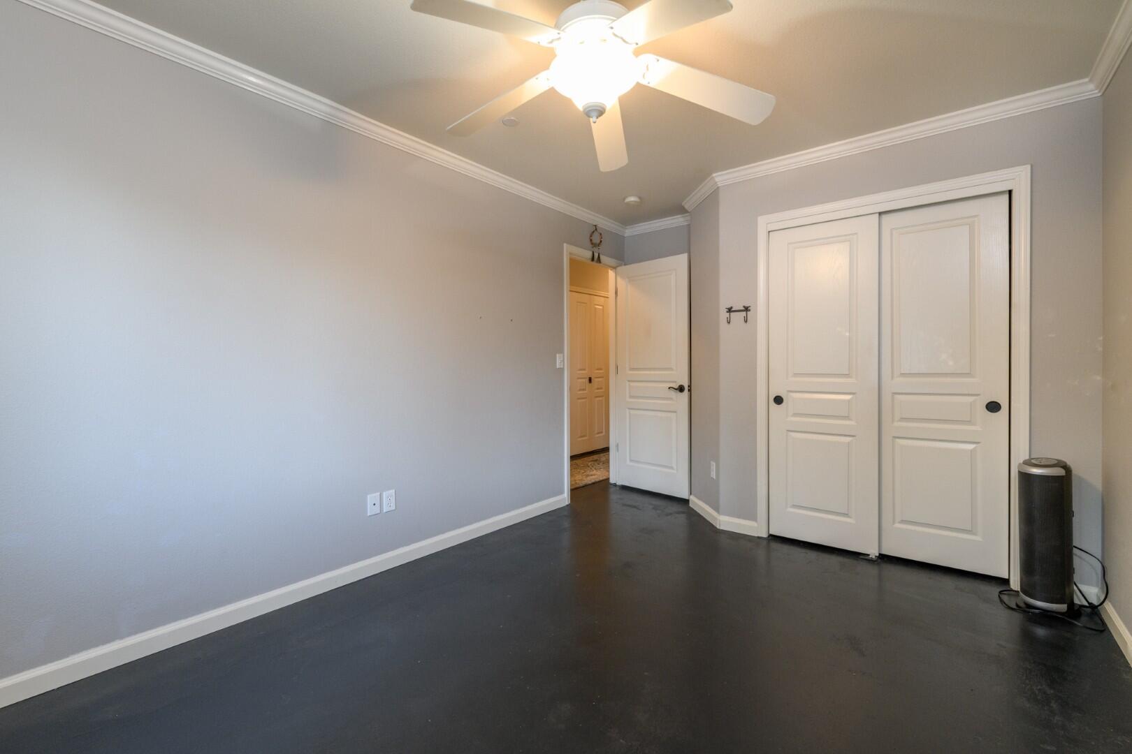 671 Valleybrook Drive Redding, CA 96003 - Photo 15 of 20 an empty room with a ceiling fan and a fan