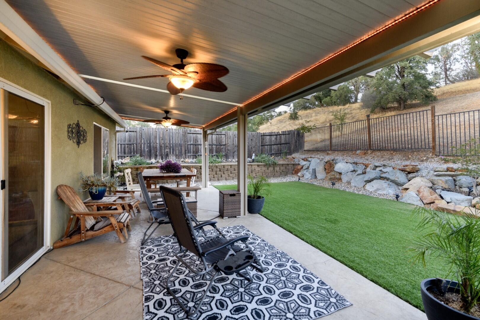 671 Valleybrook Drive Redding, CA 96003 - Photo 6 of 20 a view of a porch with furniture and a yard