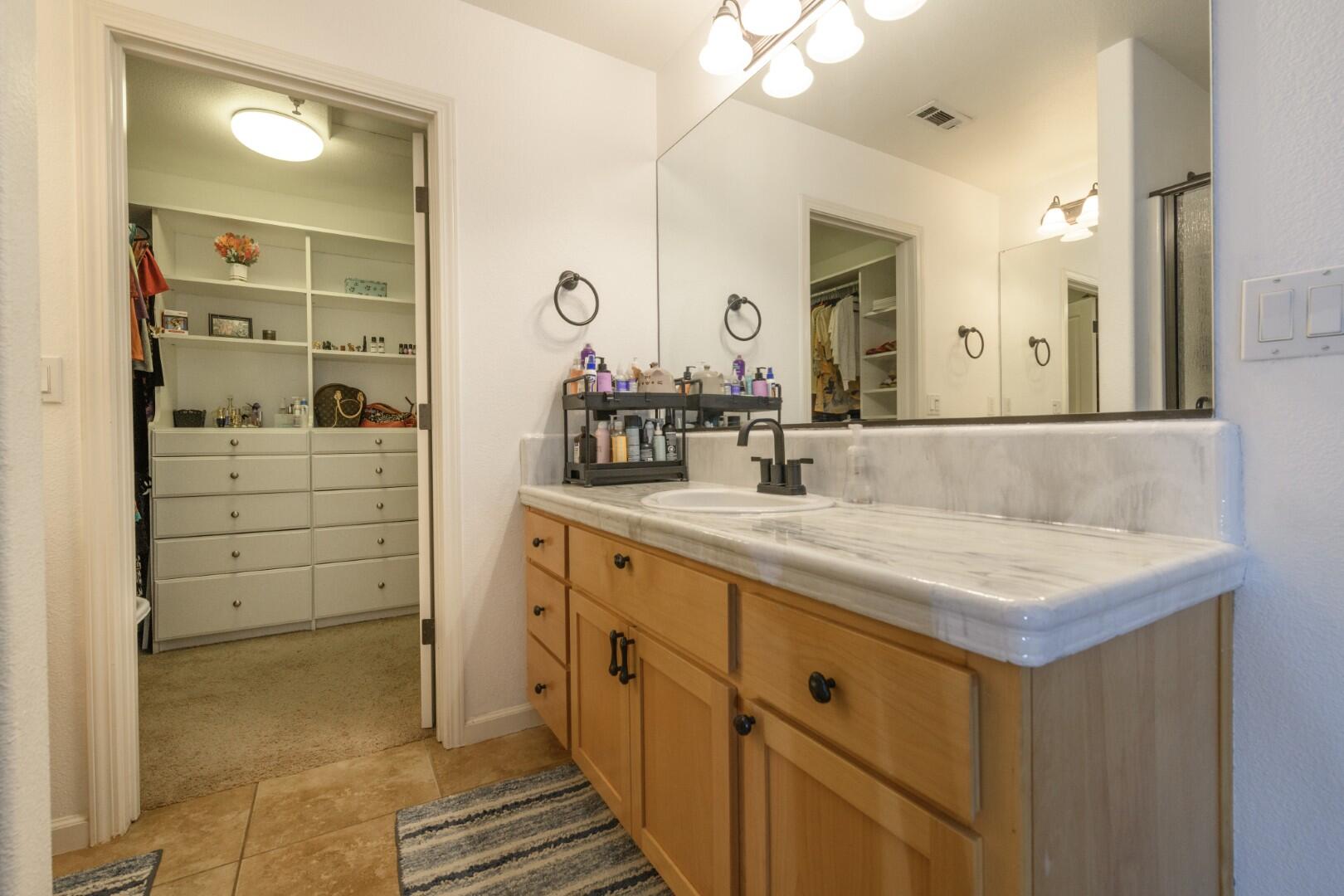 671 Valleybrook Drive Redding, CA 96003 - Photo 9 of 20 a bathroom with a sink double vanity and a mirror