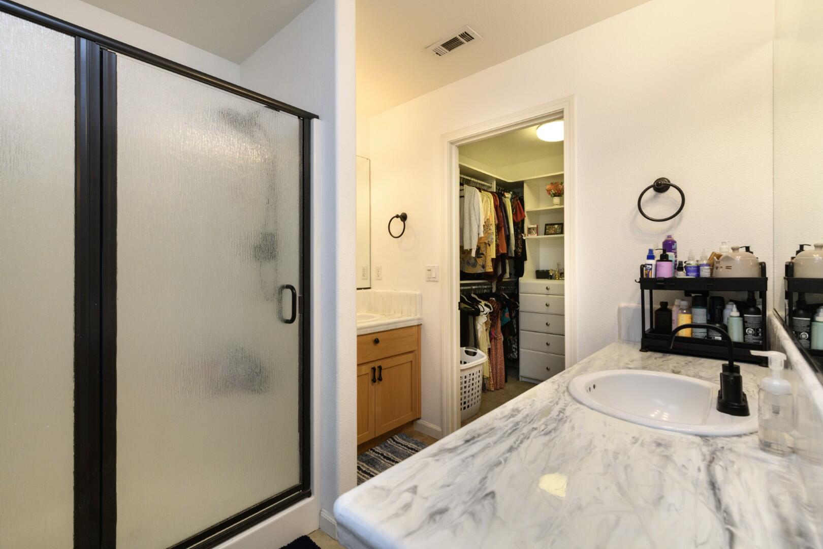 671 Valleybrook Drive Redding, CA 96003 - Photo 10 of 20 a kitchen with a refrigerator and a sink