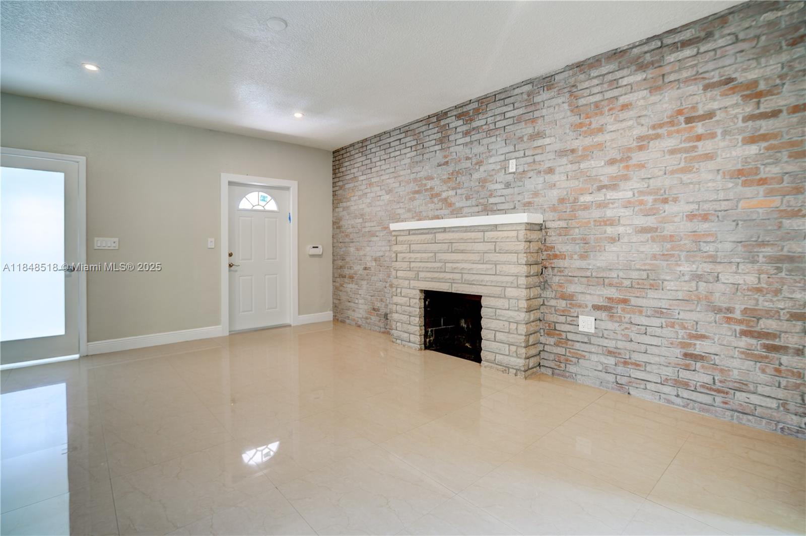 2217 Red Road Coral Gables, FL 33155 - Photo 11 of 33 a view of empty room with a fireplace