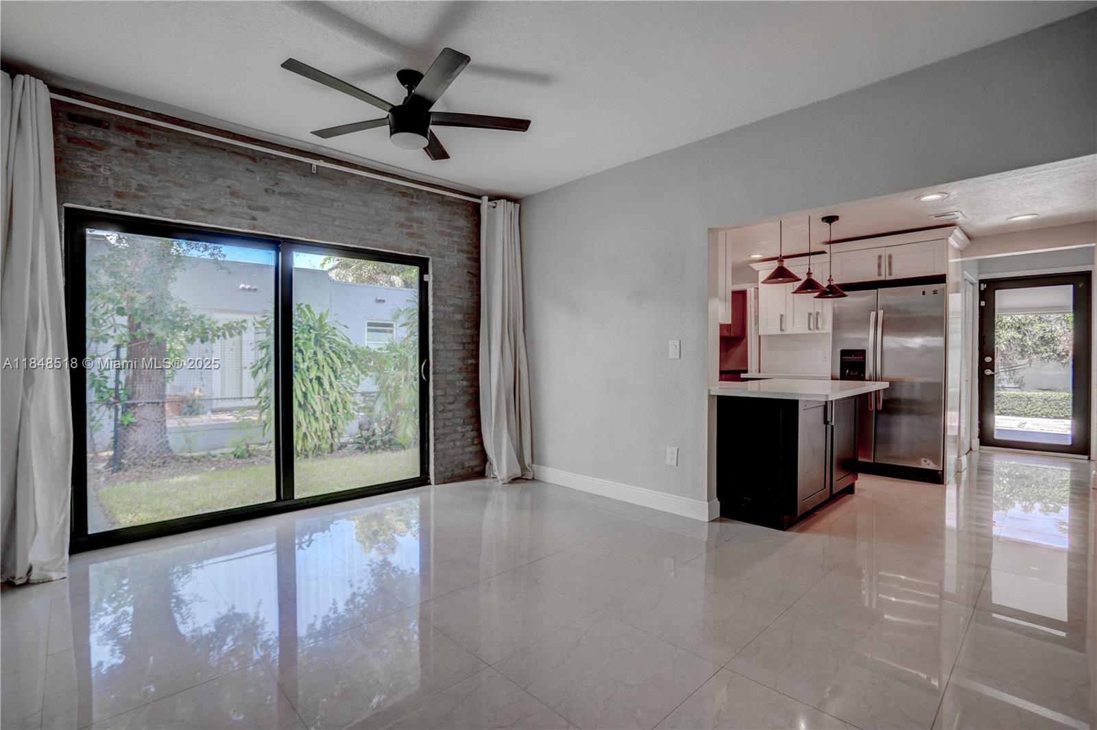 2217 Red Road Coral Gables, FL 33155 - Photo 13 of 33 a view of a kitchen with a sink and a refrigerator