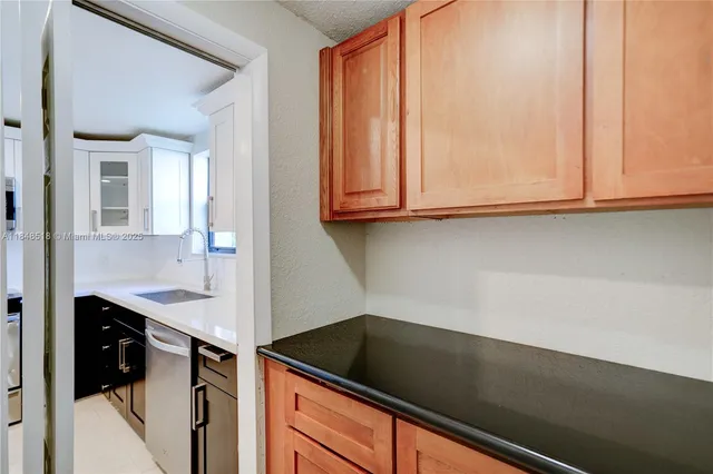 a close view of sink and cabinets