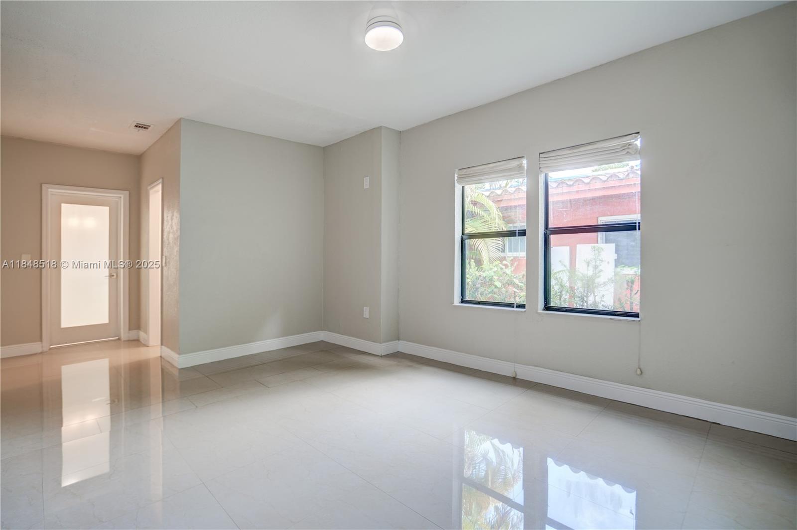 2217 Red Road Coral Gables, FL 33155 - Photo 19 of 33 a view of an empty room with a window