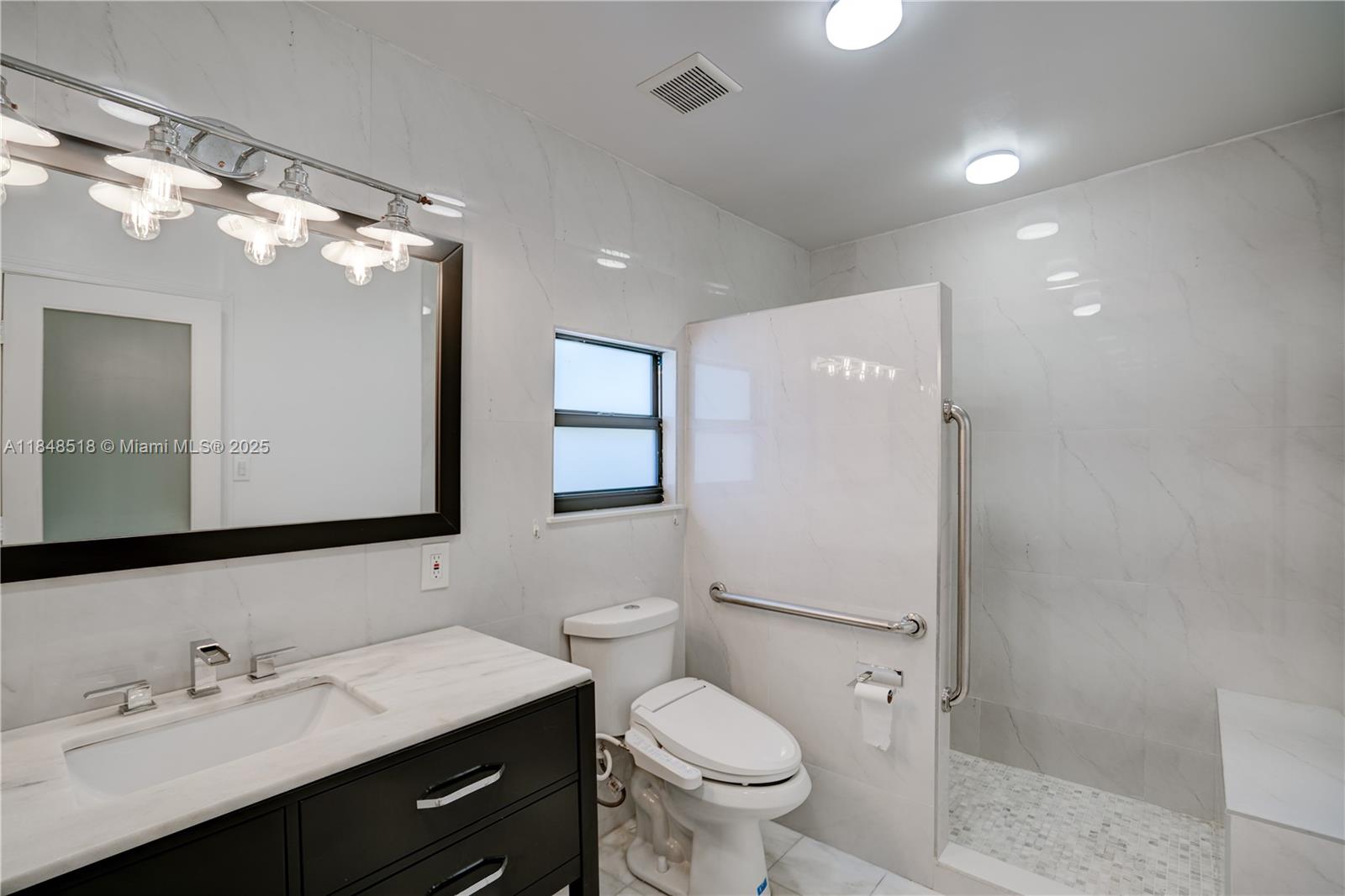 2217 Red Road Coral Gables, FL 33155 - Photo 22 of 33 a bathroom with a toilet sink double vanity and mirror