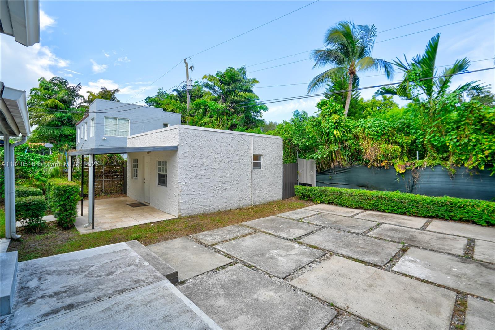 2217 Red Road Coral Gables, FL 33155 - Photo 24 of 33 a front view of a house with garden