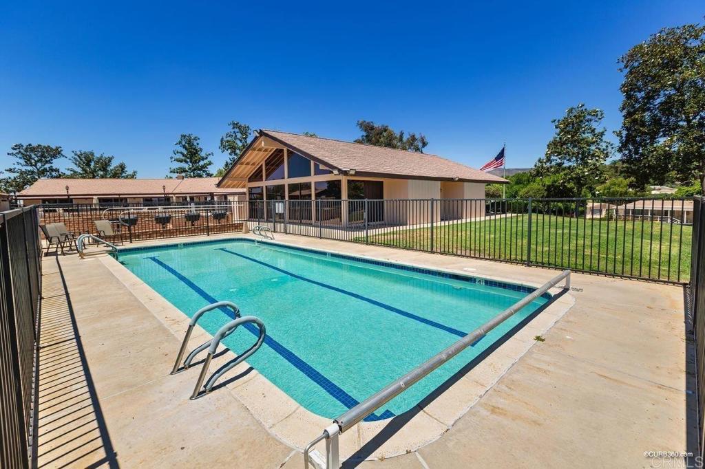 18218 Paradise Mountain Road, Unit 220 Valley Center, CA 92082 - Photo 13 of 48 a view of a house with backyard and deck