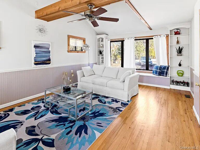8 School Street Hampton Bays, NY 11946 - Photo 11 of 24 a living room with furniture and wooden floor