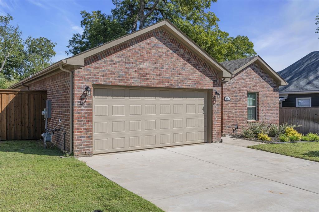 117 West Morton Street Denison, TX 75021 - Photo 2 of 29 View of front of house featuring a front lawn and a garage