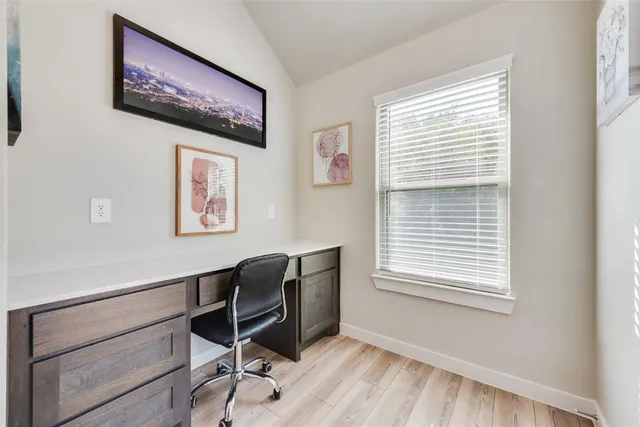 a workspace with furniture and a window