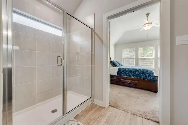 a bedroom with a bed and a mirror