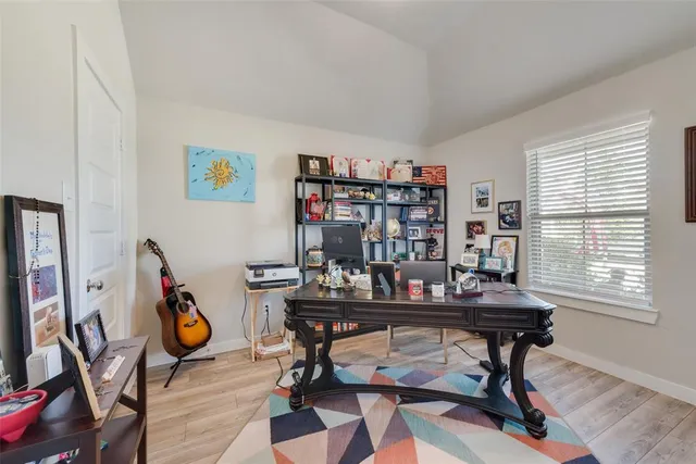 a view of a workspace with furniture and toys