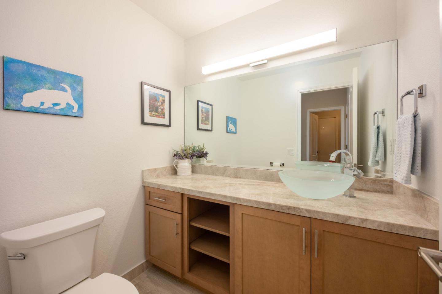 21 Merion Road Half Moon Bay, CA 94019 - Photo 16 of 35 a bathroom with a granite countertop sink mirror and toilet