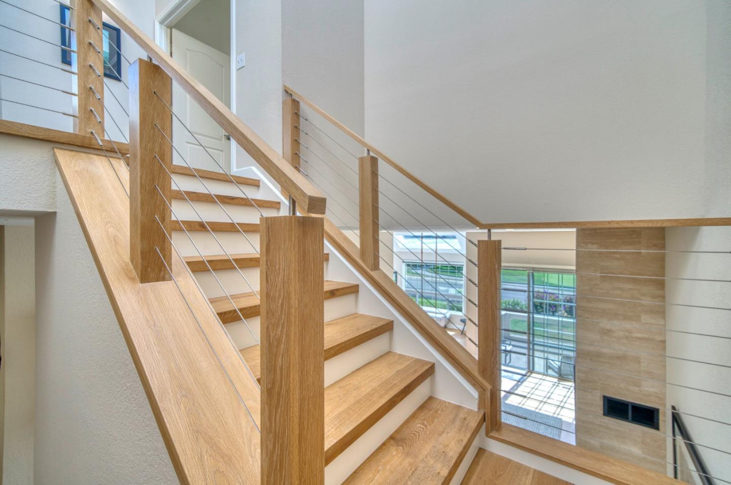 21 Merion Road Half Moon Bay, CA 94019 - Photo 17 of 35 a view of staircase with wooden floor and white walls