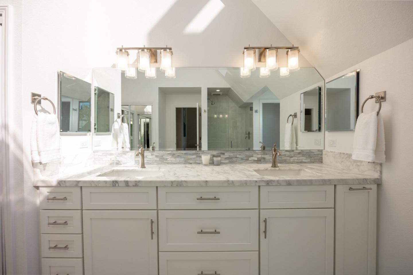 21 Merion Road Half Moon Bay, CA 94019 - Photo 22 of 35 a bathroom with a granite countertop sink mirror and cabinets