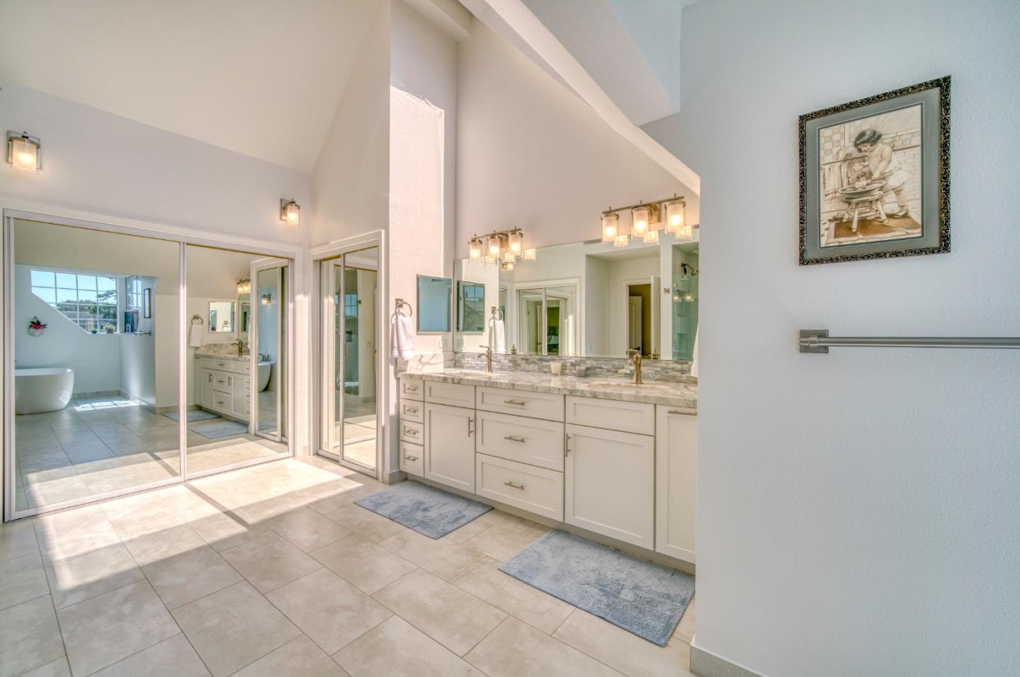 21 Merion Road Half Moon Bay, CA 94019 - Photo 23 of 35 a spacious bathroom with a shower a sink and mirror