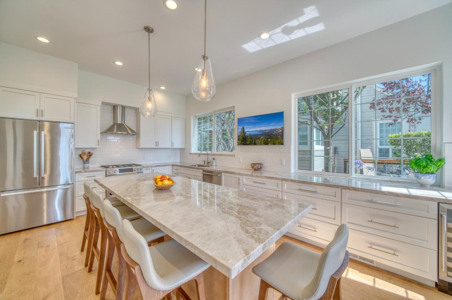 21 Merion Road Half Moon Bay, CA 94019 - Photo 7 of 35 a kitchen with a table chairs refrigerator and microwave