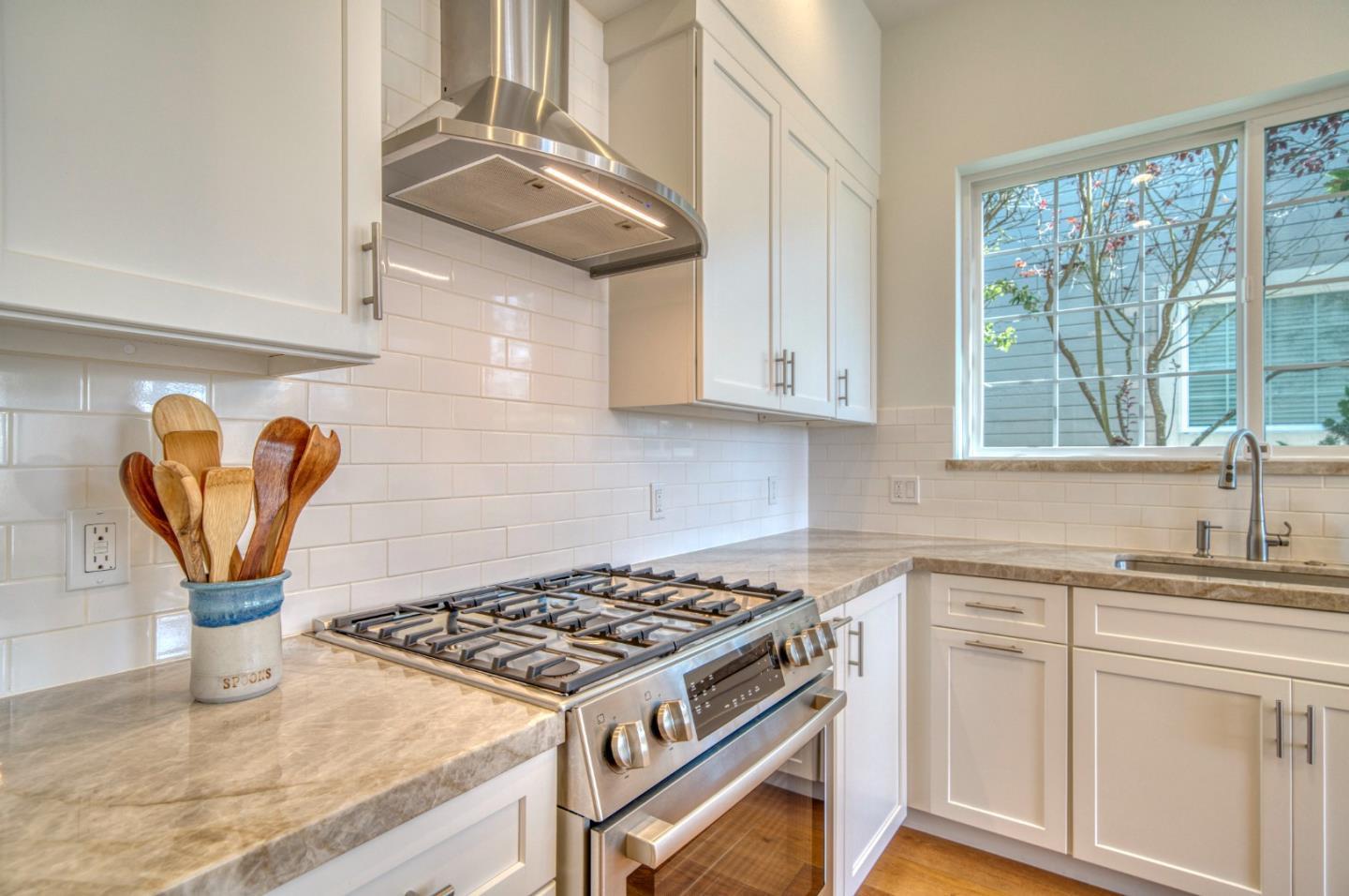 21 Merion Road Half Moon Bay, CA 94019 - Photo 9 of 35 a kitchen with stainless steel appliances granite countertop a sink stove and cabinets