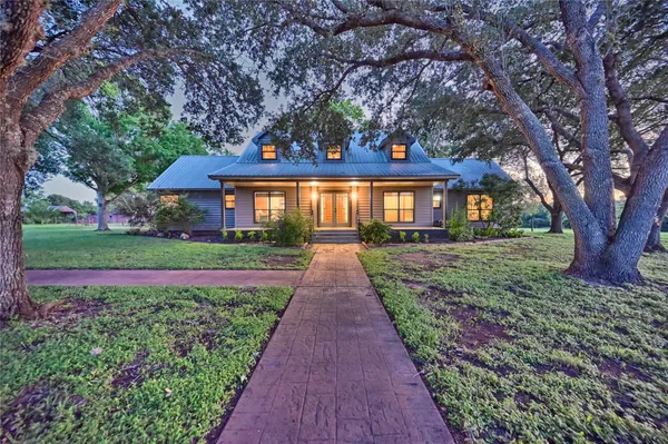 front view of a house with a yard