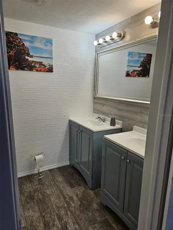 a bathroom with a sink and mirror
