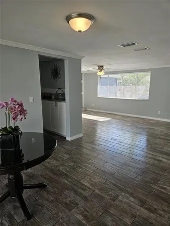 a view of a livingroom with wooden floor