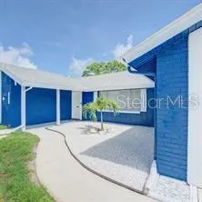 a view of a house with a yard and garage