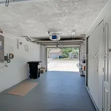 a view of water heater room with wooden floor