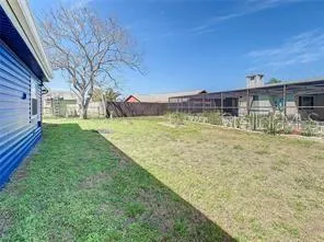 a view of swimming pool with a yard