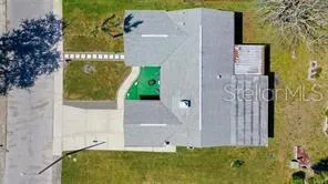 a view of a potted plant in front of a door
