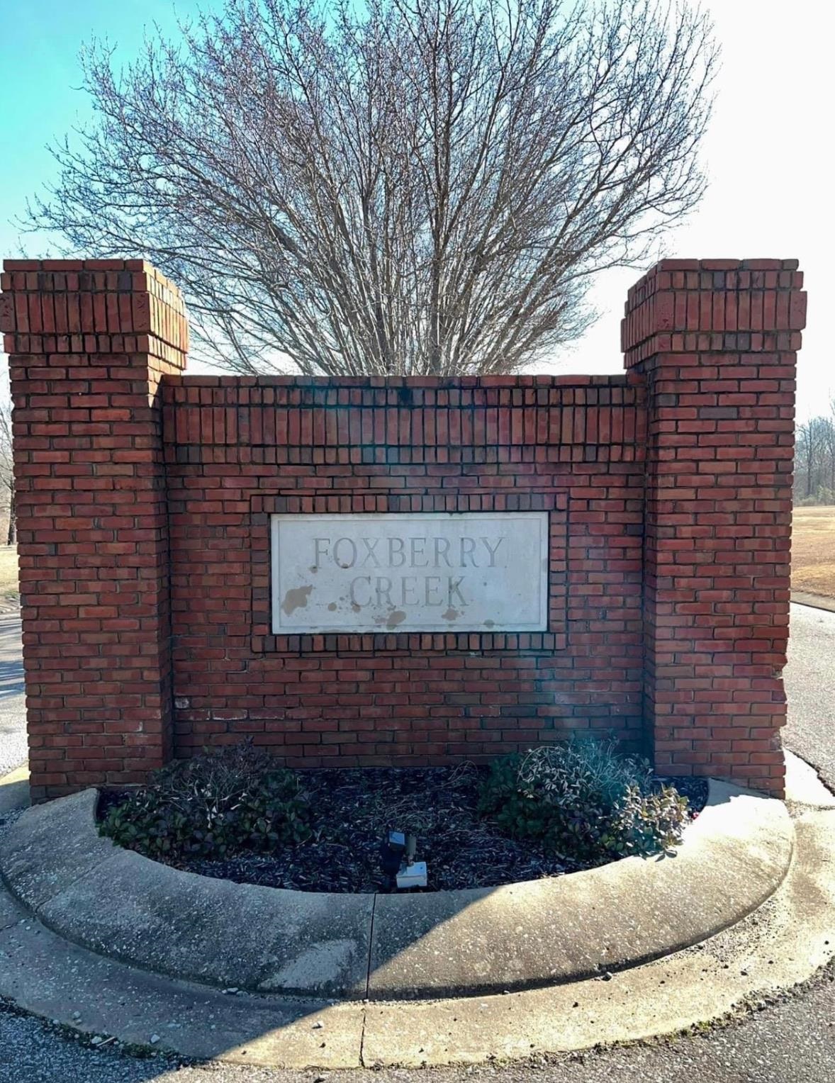 0 Thornhill Gardens Road Ripley, TN 38063 - Photo 3 of 5 a brick building with a bench in front of it