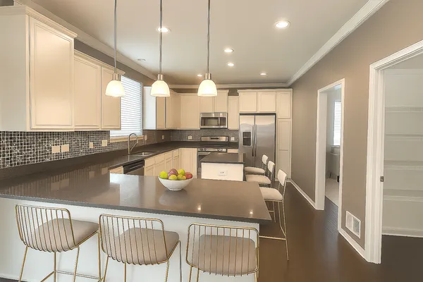 a kitchen with a dining table chairs and a refrigerator