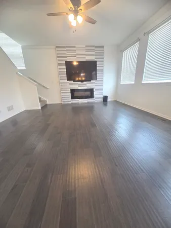 wooden floor in an empty room with a fireplace