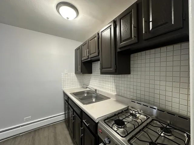 a kitchen with a stove and a microwave