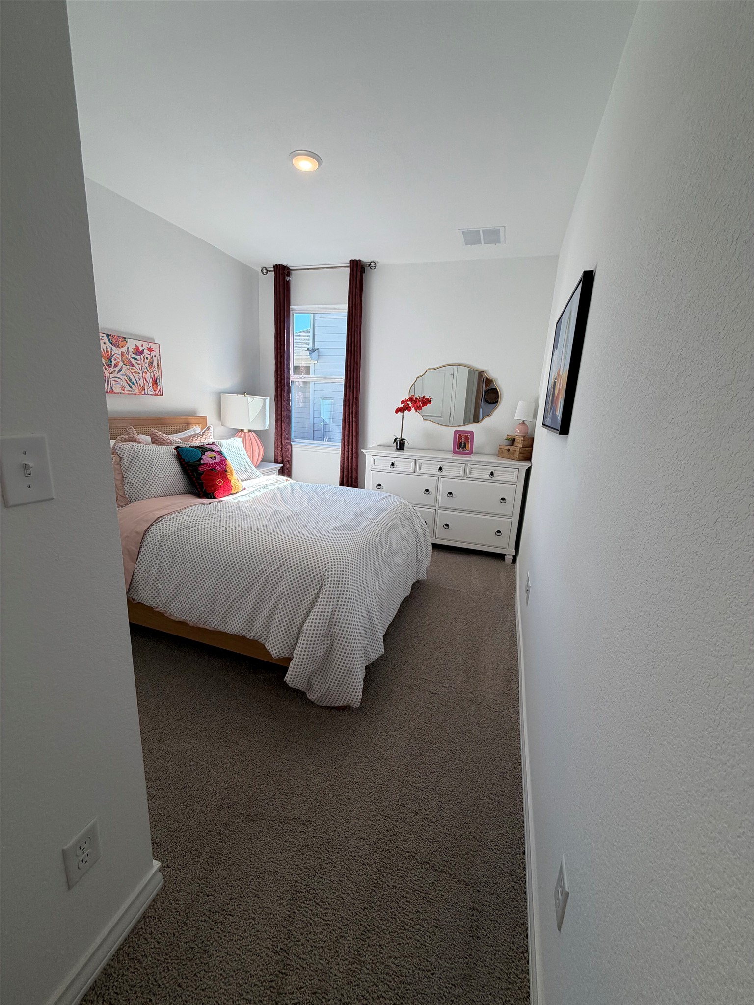 306 Stinchcomb Road Hutto, TX 78634 - Photo 14 of 19 a bedroom with a bed and window