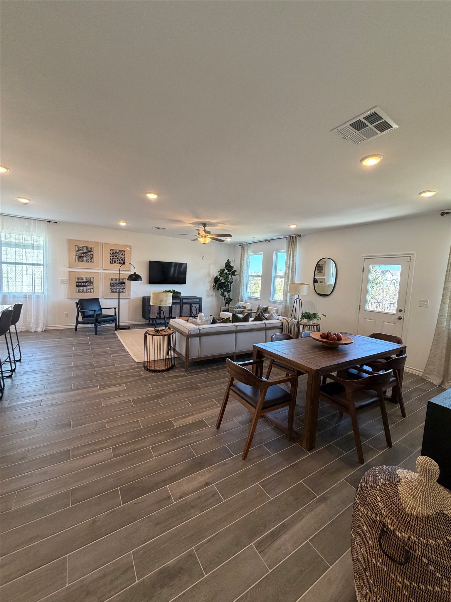 306 Stinchcomb Road Hutto, TX 78634 - Photo 6 of 19 a living room with furniture a table and wooden floor