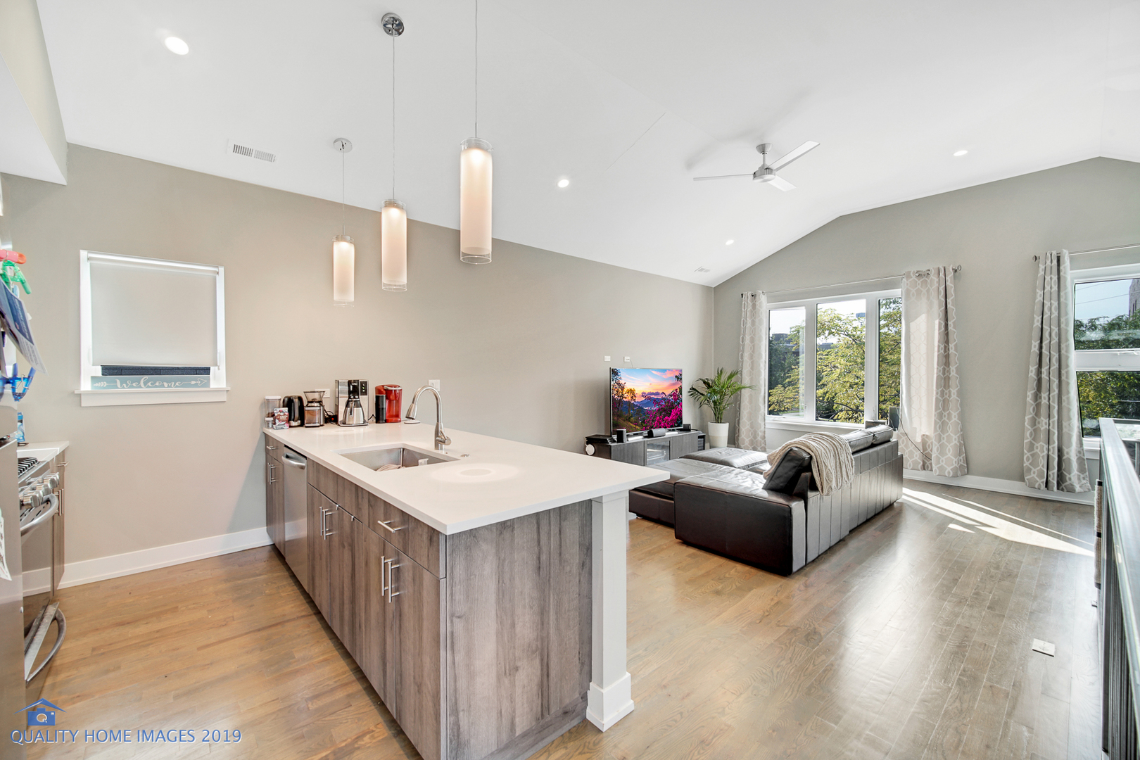 Undisclosed Address Chicago, IL 60608 - Photo 7 of 11 a kitchen that has a lot of cabinets a sink and wooden floor