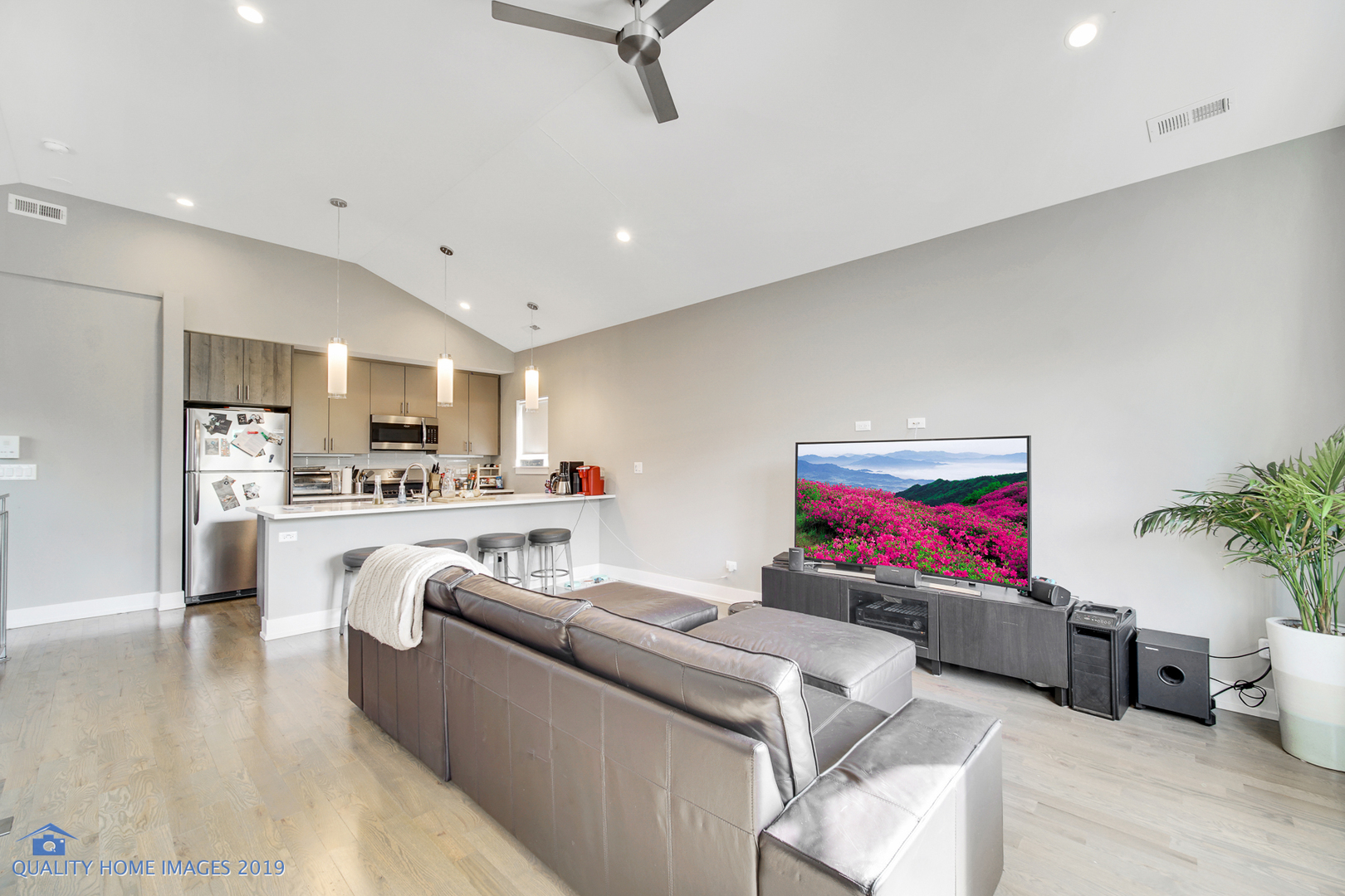 Undisclosed Address Chicago, IL 60608 - Photo 9 of 11 a living room with furniture and a flat screen tv