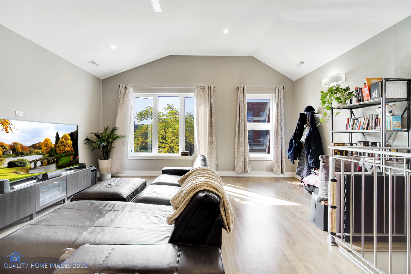 Undisclosed Address Chicago, IL 60608 - Photo 10 of 11 a living room with furniture and a flat screen tv