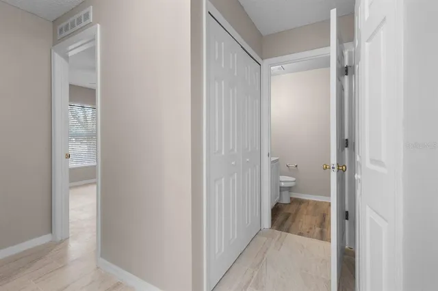 a view of a bathroom from a hallway