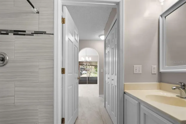 a bathroom with a sink and a mirror