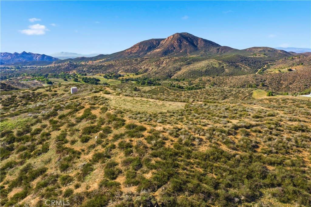 33850 Stage Road Temecula, CA 92592 - Photo 1 of 13 a view of a mountain range in a cloudy sky