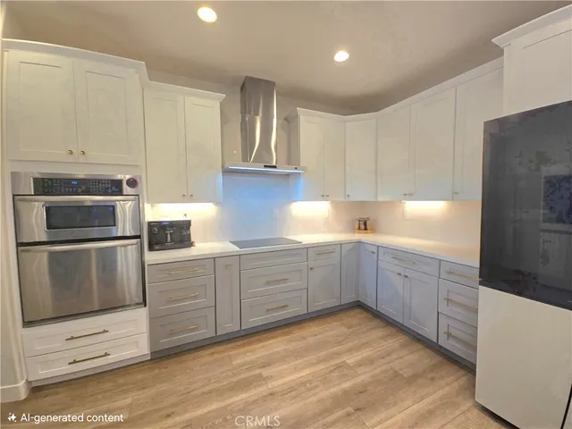a kitchen with granite countertop white cabinets and stainless steel appliances