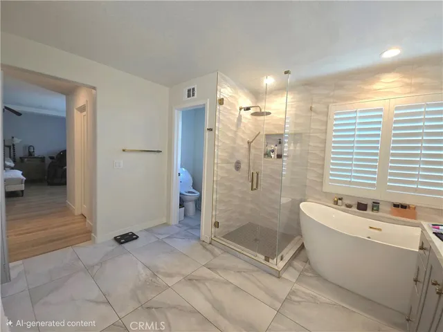 a bathroom with a bathtub a toilet and a shower
