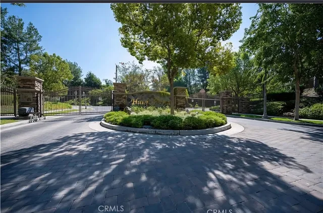 a view of a fountain in front of a house