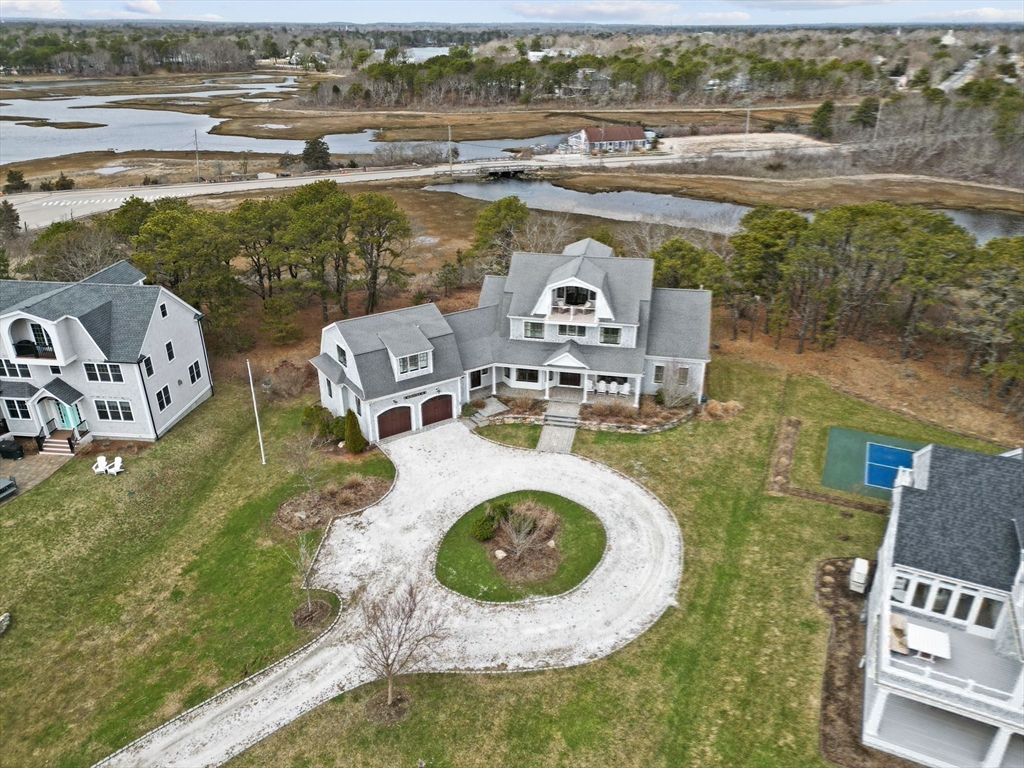 10 Uncle Stephens Road Dennis, MA 02670 - Photo 40 of 42 an aerial view of a house with outdoor space swimming pool and lake view