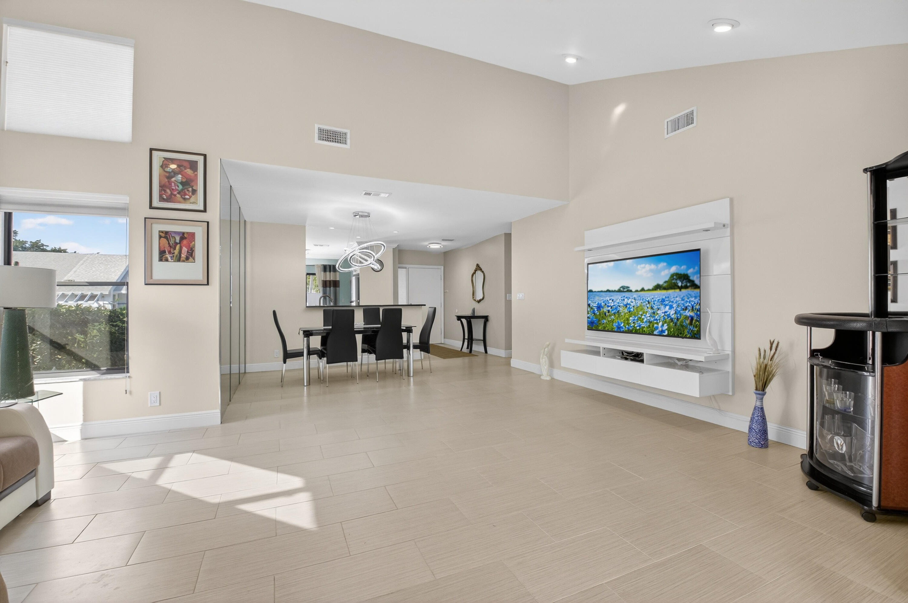 10980 Hidden Lake Place Boca Raton, FL 33498 - Photo 14 of 47 a view of a living room and a flat screen tv