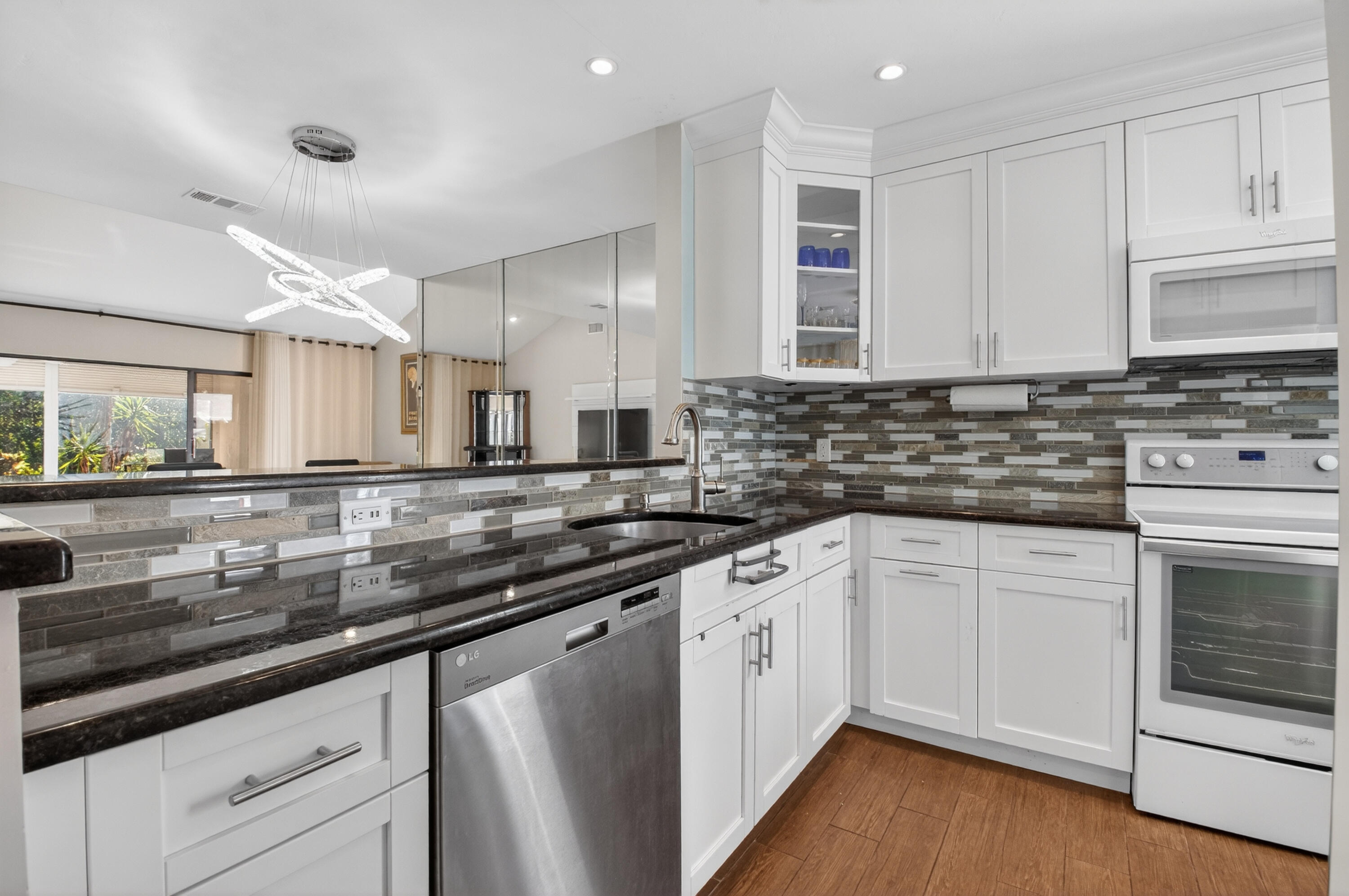10980 Hidden Lake Place Boca Raton, FL 33498 - Photo 2 of 47 a kitchen with stainless steel appliances granite countertop a sink and cabinets