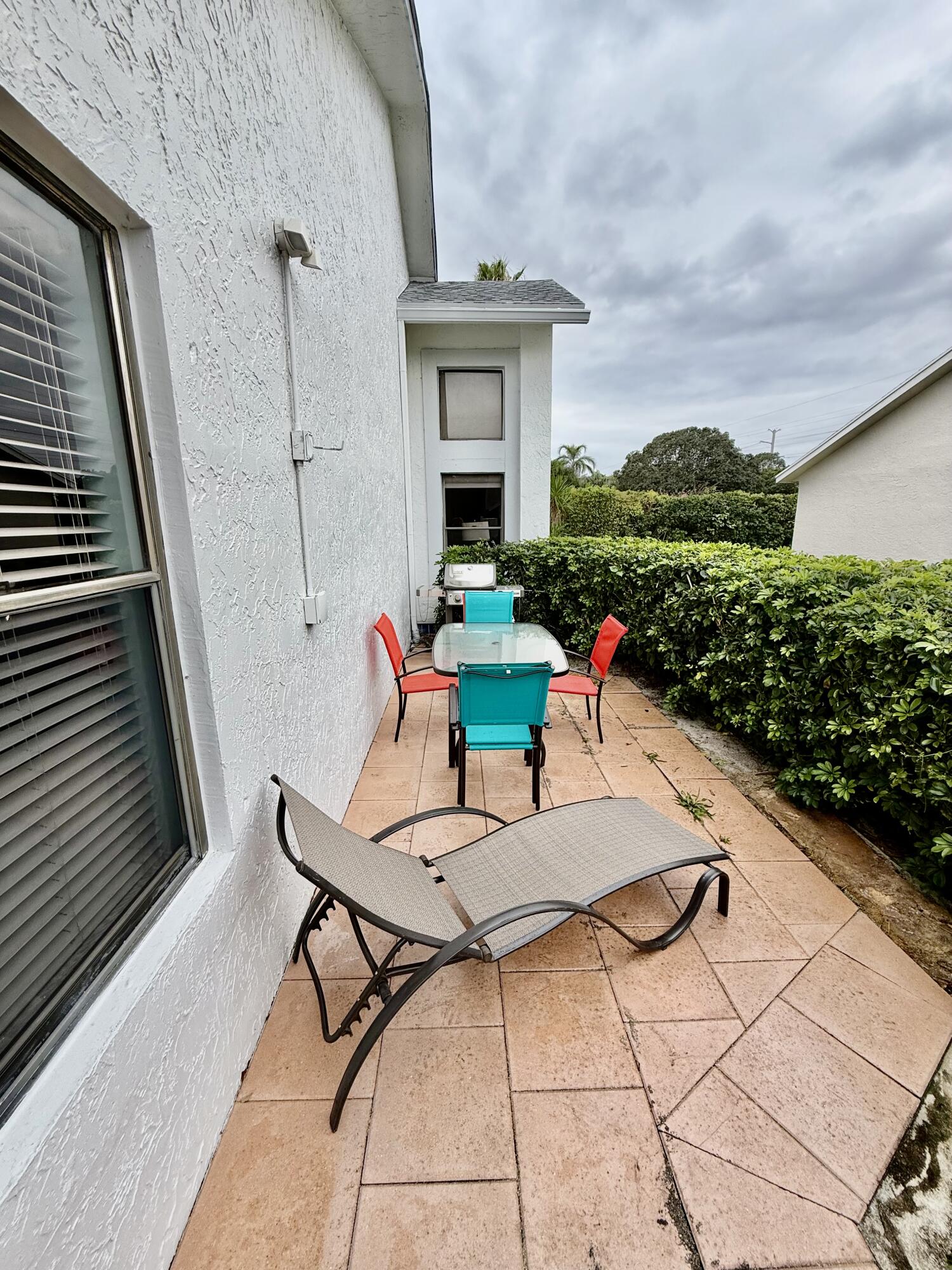 10980 Hidden Lake Place Boca Raton, FL 33498 - Photo 26 of 47 a view of house with backyard and outdoor seating