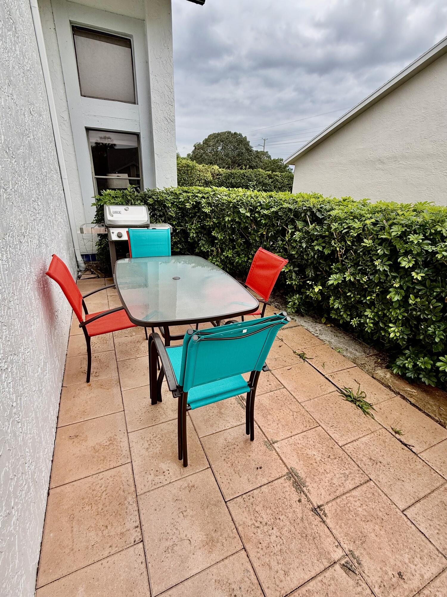 10980 Hidden Lake Place Boca Raton, FL 33498 - Photo 28 of 47 a backyard of a house with outdoor seating